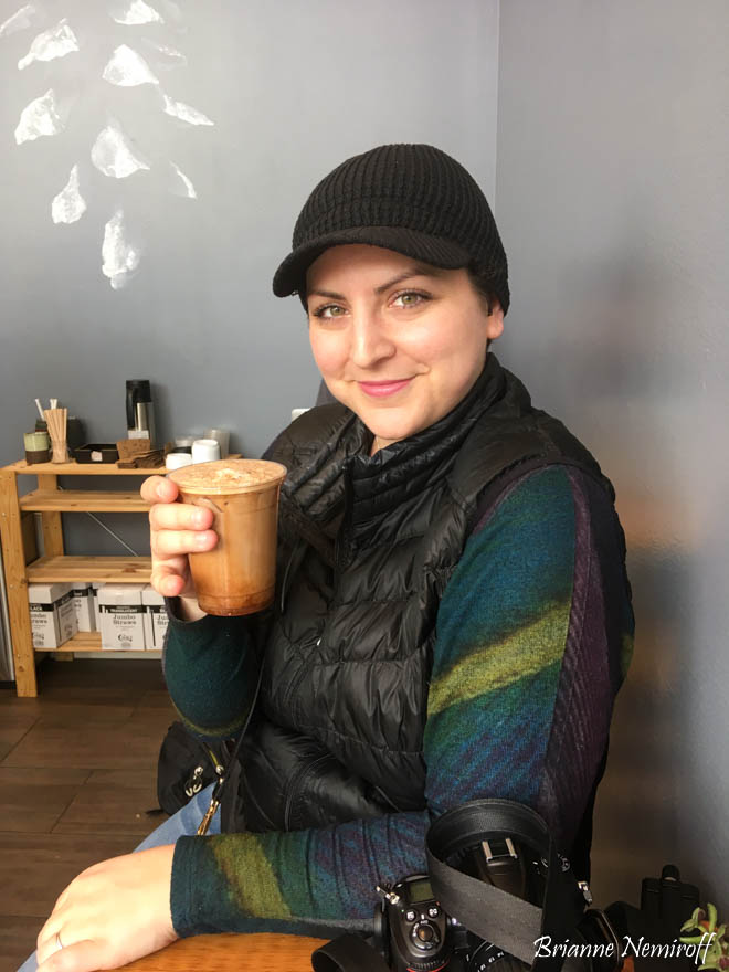 Brianne Nemiroff drinking coffee at Three Pines Coffee in Downtown Salt Lake City