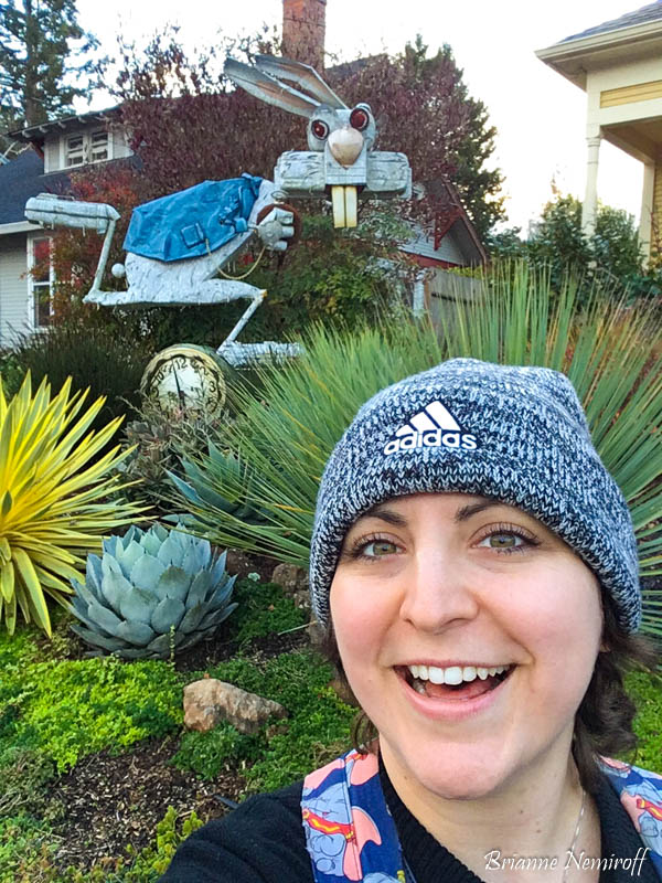 Brianne Nemiroff with sculpture by Patrick Amiot on Florence Avenue in Sebastopol