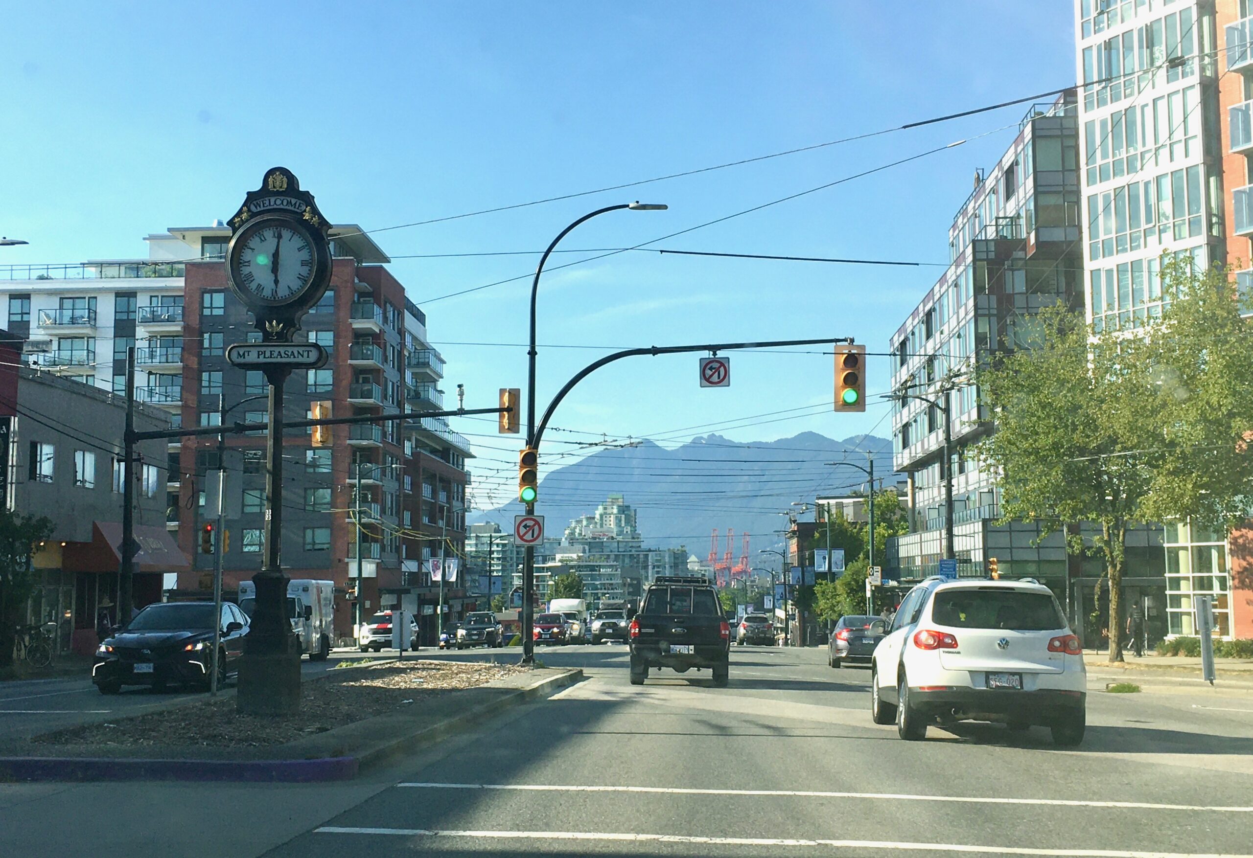 view of north Vancouver from main street, mount pleasant clock, vegan business
